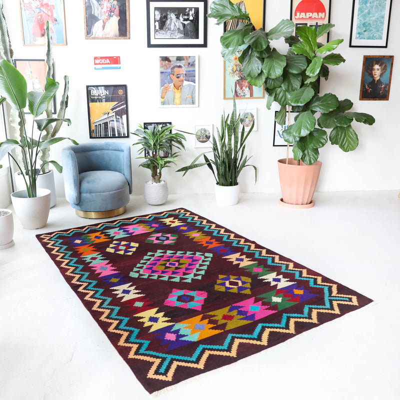 Vintage kilim rug in living room setting, bright colors, wild shaman, soft rug, bold color, Portland, Oregon, rug store, rug shop, local shop, vintage rug, modern kilim, warm colors