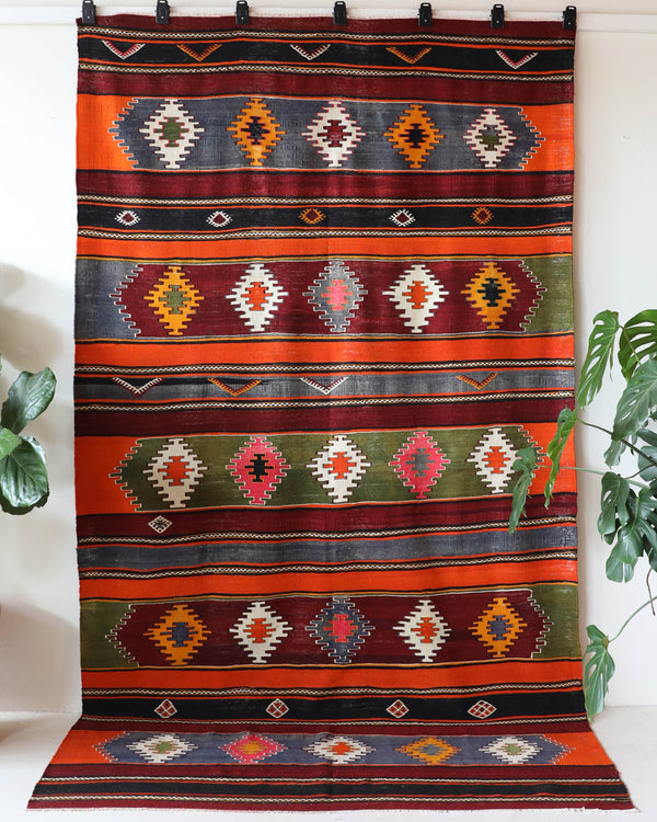 Vintage kilim rug in living room setting, bright colors, wild shaman, soft rug, bold color, Portland, Oregon, rug store, rug shop, local shop, vintage rug, modern kilim, warm colors