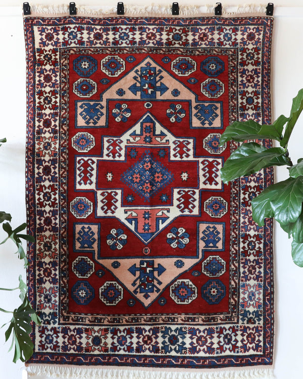 Vintage Turkish rug in a living room setting, pile rug, Turkish rug, vintage rug, portland, rug shop, bright colors, wild shaman, soft rug, bold color, Portland, Oregon, rug store, rug shop, local shop, antique rug