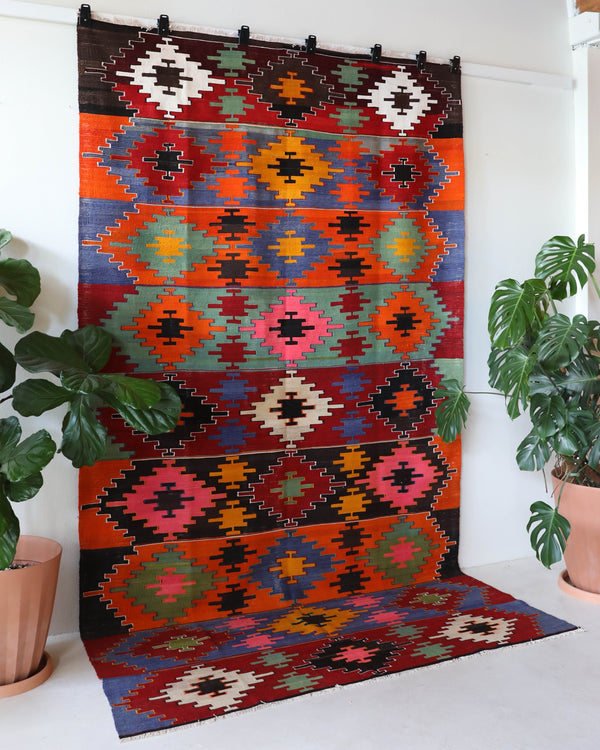 Vintage kilim rug in living room setting, bright colors, wild shaman, soft rug, bold color, Portland, Oregon, rug store, rug shop, local shop, vintage rug, modern kilim, warm colors