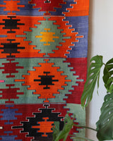 Vintage kilim rug in living room setting, bright colors, wild shaman, soft rug, bold color, Portland, Oregon, rug store, rug shop, local shop, vintage rug, modern kilim, warm colors