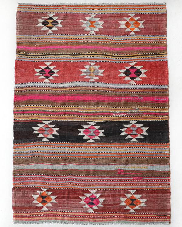 Vintage kilim rug in room decor setting, old rug, antique rug, pastel colors, faded colors, Turkish rug, vintage rug, soft rug, Portland, Oregon, rug store, rug shop, local shop, bold colors, bright colors, faded colors