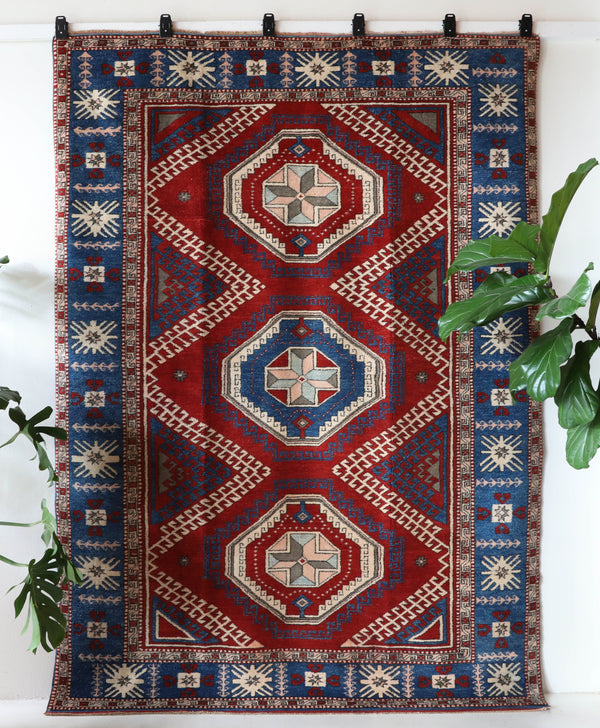 Vintage Turkish rug in a living room setting, pile rug, Turkish rug, vintage rug, portland, rug shop, bright colors, wild shaman, soft rug, bold color, Portland, Oregon, rug store, rug shop, local shop, antique rug