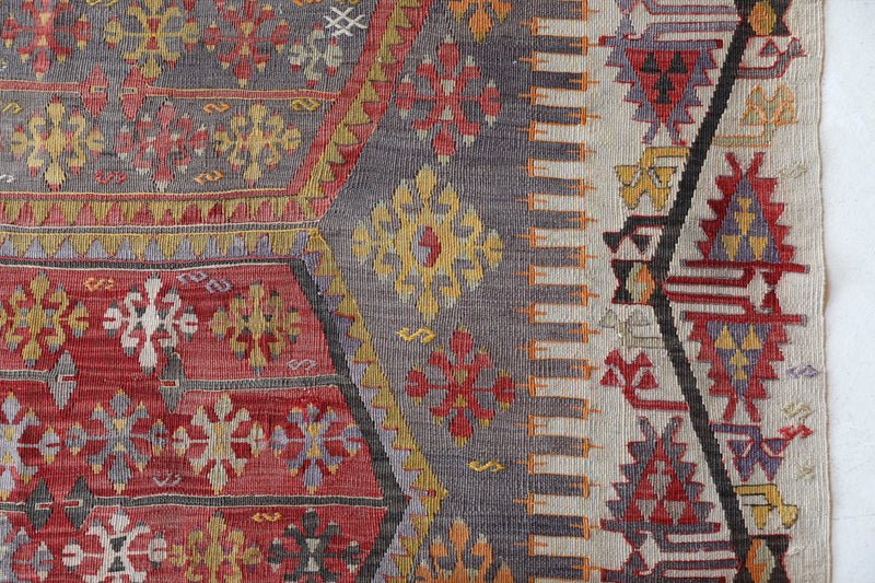 Vintage kilim rug in room decor setting, old rug, antique rug, pastel colors, faded colors, Turkish rug, vintage rug, soft rug, Portland, Oregon, rug store, rug shop, local shop,  antique kilim rug