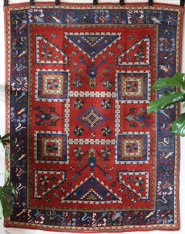 Vintage Turkish rug in a living room setting, pile rug, Turkish rug, vintage rug, portland, rug shop, bright colors, wild shaman, soft rug, bold color, Portland, Oregon, rug store, rug shop, local shop, antique rug