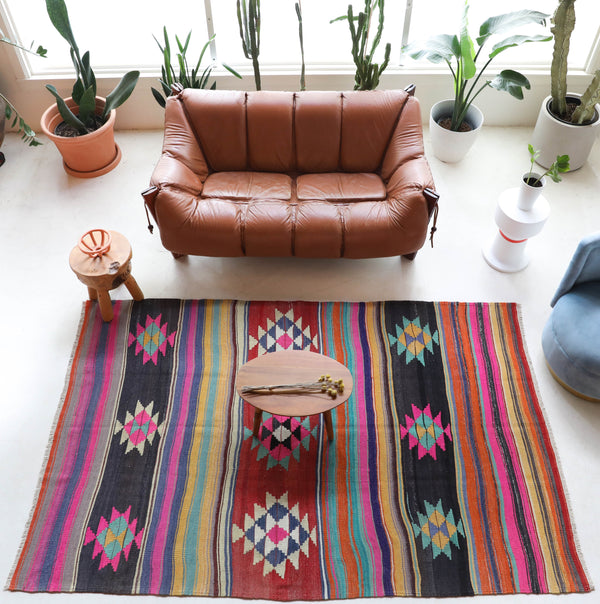 Vintage kilim rug in living room setting, bright colors, wild shaman, soft rug, bold color, Portland, Oregon, rug store, rug shop, local shop, vintage rug, modern kilim, warm colors