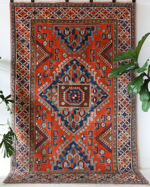 Vintage Turkish rug in a living room setting, pile rug, Turkish rug, vintage rug, portland, rug shop, bright colors, wild shaman, soft rug, bold color, Portland, Oregon, rug store, rug shop, local shop, antique rug