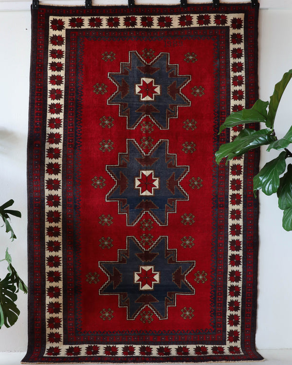 Vintage Turkish rug in a living room setting, pile rug, Turkish rug, vintage rug, portland, rug shop, bright colors, wild shaman, soft rug, bold color, Portland, Oregon, rug store, rug shop, local shop, antique rug