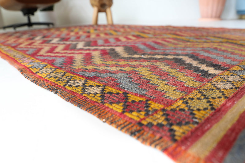 Vintage kilim rug in living room setting, bright colors, wild shaman, soft rug, bold color, Portland, Oregon, rug store, rug shop, local shop, vintage rug, modern kilim, warm colors