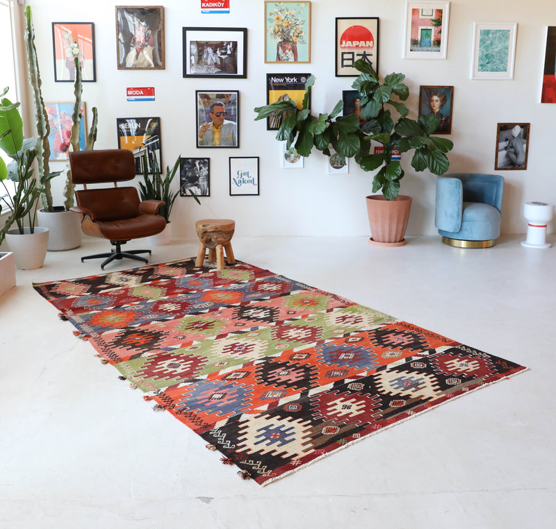 Vintage kilim rug in living room setting, bright colors, wild shaman, soft rug, bold color, Portland, Oregon, rug store, rug shop, local shop, vintage rug, modern kilim, warm colors