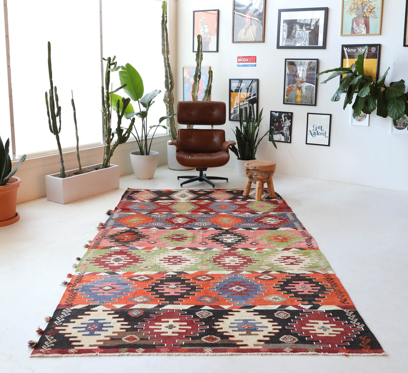 Vintage kilim rug in living room setting, bright colors, wild shaman, soft rug, bold color, Portland, Oregon, rug store, rug shop, local shop, vintage rug, modern kilim, warm colors