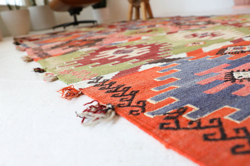 Vintage kilim rug in living room setting, bright colors, wild shaman, soft rug, bold color, Portland, Oregon, rug store, rug shop, local shop, vintage rug, modern kilim, warm colors