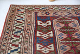 Vintage Turkish mini rug in room decor setting, old rug, antique rug, pastel colors, faded colors, Turkish rug, vintage rug, soft rug, Portland, Oregon, rug store, rug shop, local shop,  bright colors, bold colors