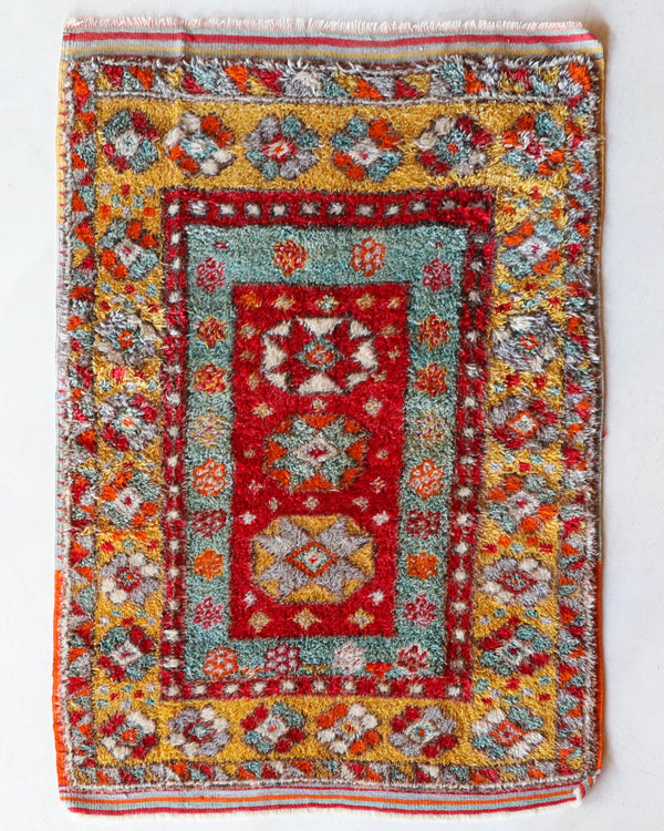 Small Turkish rug in a living room setting, pile rug, Turkish rug, vintage rug, portland, rug shop, bright colors, wild shaman, area rug, red rug, mini rug, bold color, Portland, Oregon, rug store, rug shop, local shop, flat weave, kilim rug