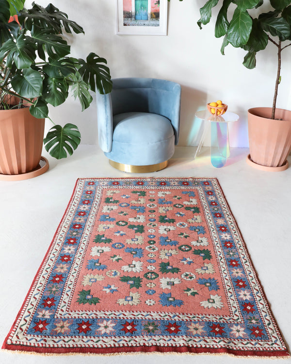 Small Turkish rug in a living room setting, pile rug, Turkish rug, vintage rug, portland, rug shop, bright colors, wild shaman, area rug, red rug, mini rug, bold color, Portland, Oregon, rug store, rug shop, local shop, flat weave, kilim rug