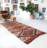 Vintage kilim rug in living room setting, old rug, antique rug, pastel colors, faded colors, Turkish rug, vintage rug, soft rug, Portland, Oregon, rug store, rug shop, local shop, earthy tones, earthy colors, warm colors