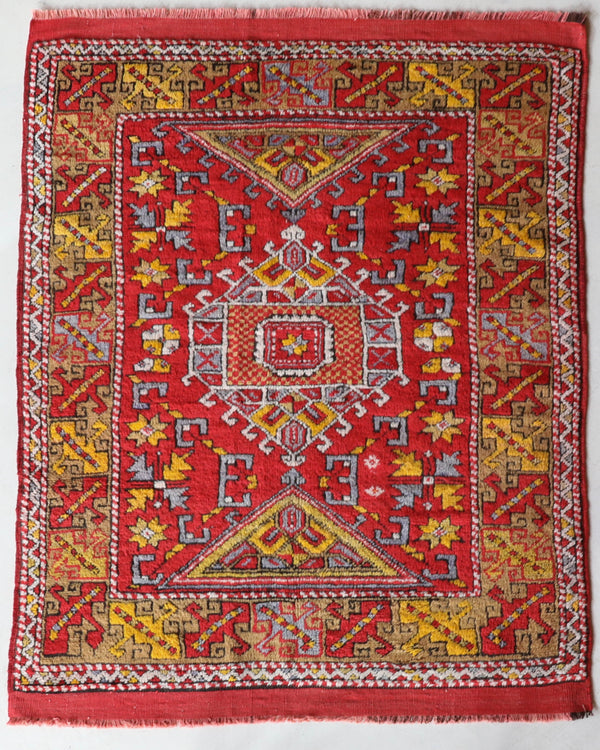 Small Turkish rug in a living room setting, pile rug, Turkish rug, vintage rug, portland, rug shop, bright colors, wild shaman, area rug, red rug, mini rug, bold color, Portland, Oregon, rug store, rug shop, local shop, flat weave, kilim rug