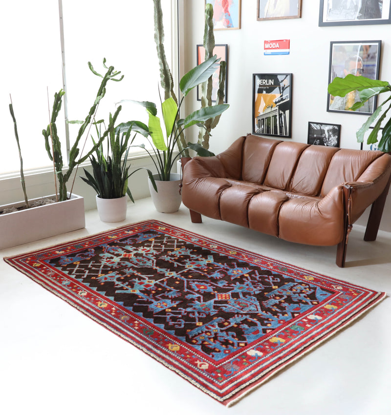 Vintage Turkish rug in a living room setting, Area rug in a living room setting, pile rug, Turkish rug, modern rug, customizable rug, portland, rug shop, bright colors, wild shaman, soft rug, bold color, Portland, Oregon, rug store, rug shop, local shop, made in Turkey