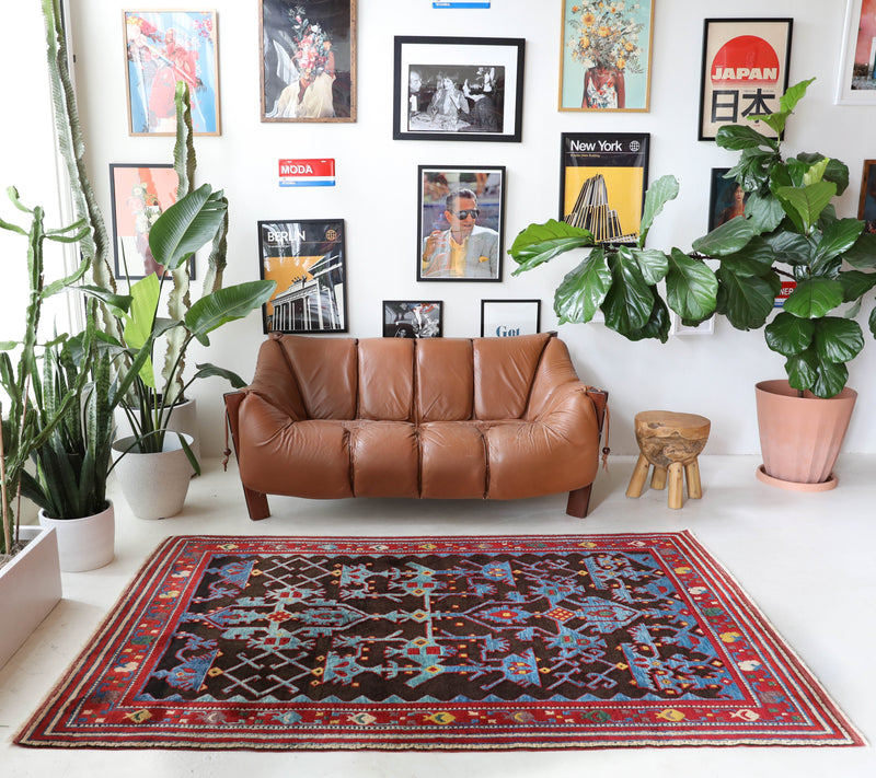 Vintage Turkish rug in a living room setting, Area rug in a living room setting, pile rug, Turkish rug, modern rug, customizable rug, portland, rug shop, bright colors, wild shaman, soft rug, bold color, Portland, Oregon, rug store, rug shop, local shop, made in Turkey