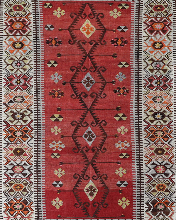 Vintage kilim rug in room decor setting, old rug, antique rug, pastel colors, faded colors, Turkish rug, vintage rug, soft rug, Portland, Oregon, rug store, rug shop, local shop,  antique kilim rug, bold colors, bright colors, faded colors