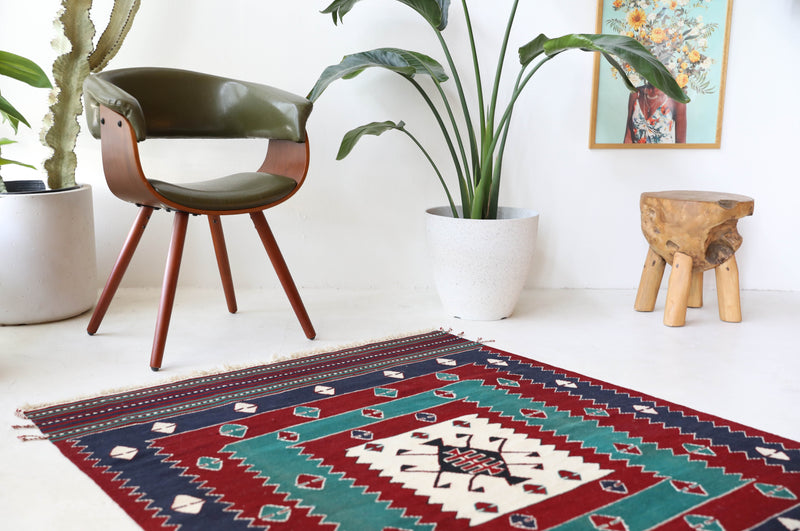 Vintage kilim rug in living room setting, bright colors, wild shaman, soft rug, bold color, Portland, Oregon, rug store, rug shop, local shop, vintage rug, modern kilim, warm colors, antique kilim rug