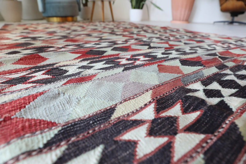 Vintage kilim rug in living room setting, old rug, antique rug, pastel colors, faded colors, Turkish rug, vintage rug, soft rug, Portland, Oregon, rug store, rug shop, local shop, earthy tones, earthy colors, warm colorsVintage kilim rug in living room setting, old rug, antique rug, pastel colors, faded colors, Turkish rug, vintage rug, soft rug, Portland, Oregon, rug store, rug shop, local shop, earthy tones, earthy colors, warm colors