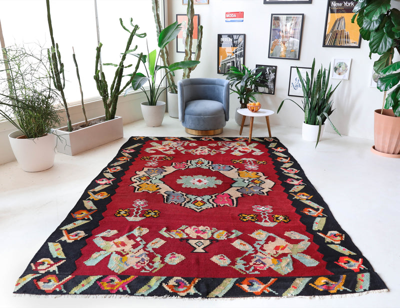 Vintage kilim rug in living room setting, bright colors, wild shaman, soft rug, bold color, Portland, Oregon, rug store, rug shop, local shop, vintage rug, modern kilim, warm colors