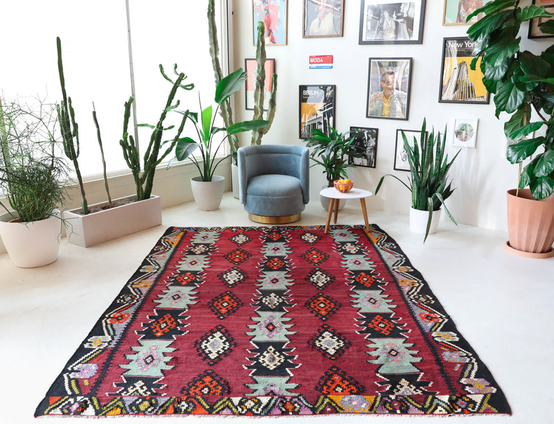 Vintage kilim rug in living room setting, bright colors, wild shaman, soft rug, bold color, Portland, Oregon, rug store, rug shop, local shop, vintage rug, modern kilim, warm colors