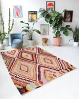 Vintage kilim rug in room decor setting, old rug, antique rug, pastel colors, faded colors, Turkish rug, vintage rug, soft rug, Portland, Oregon, rug store, rug shop, local shop,  antique kilim rug, bold colors, bright colors, faded colors