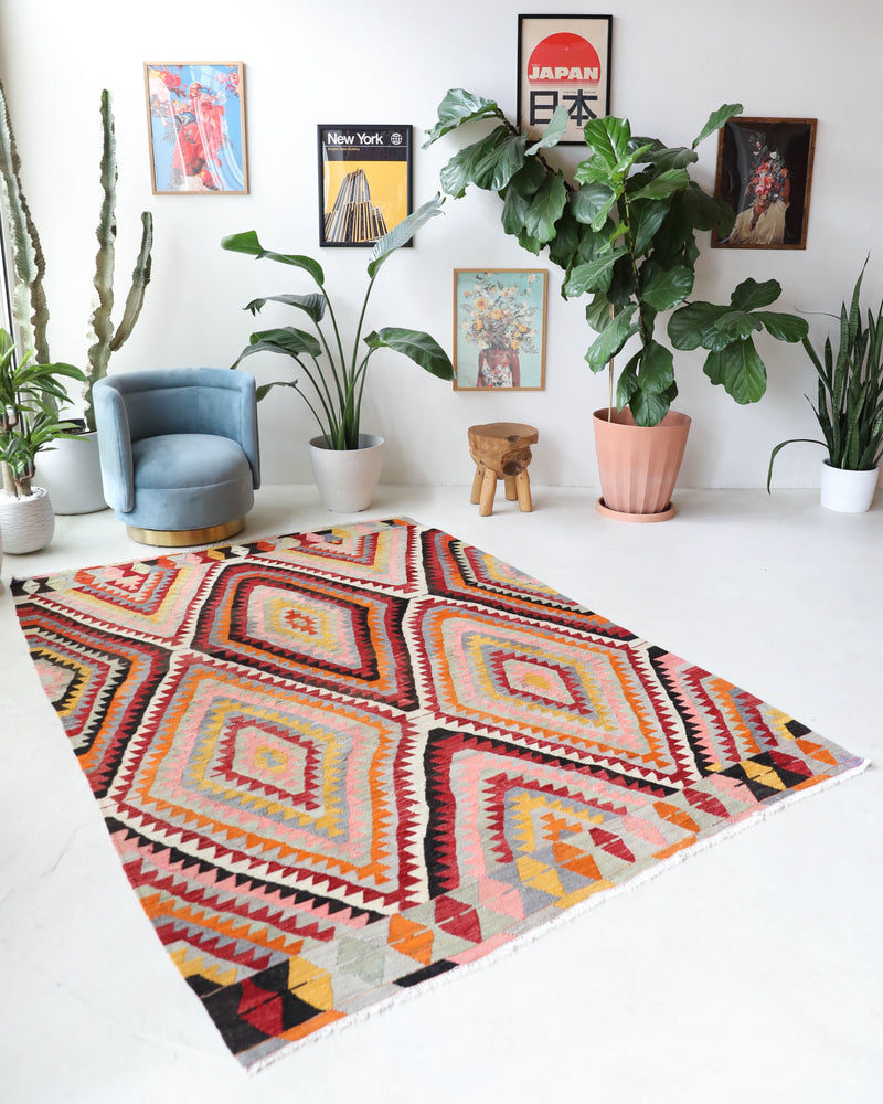 Vintage kilim rug in room decor setting, old rug, antique rug, pastel colors, faded colors, Turkish rug, vintage rug, soft rug, Portland, Oregon, rug store, rug shop, local shop,  antique kilim rug, bold colors, bright colors, faded colors