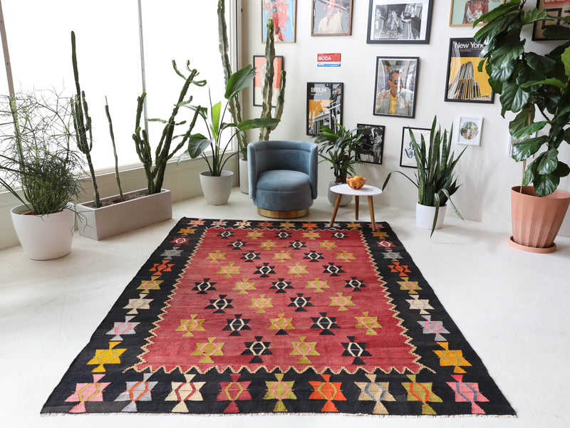 Vintage kilim rug in living room setting, bright colors, wild shaman, soft rug, bold color, Portland, Oregon, rug store, rug shop, local shop, vintage rug, modern kilim, warm colors