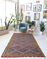 Vintage kilim rug in living room setting, bright colors, wild shaman, soft rug, bold color, Portland, Oregon, rug store, rug shop, local shop, vintage rug, modern kilim, warm colors