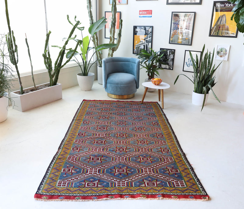 Vintage kilim rug in living room setting, bright colors, wild shaman, soft rug, bold color, Portland, Oregon, rug store, rug shop, local shop, vintage rug, modern kilim, warm colors