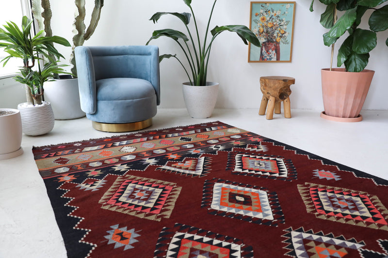 Vintage kilim rug in living room setting, bright colors, wild shaman, soft rug, bold color, Portland, Oregon, rug store, rug shop, local shop, vintage rug, modern kilim, warm colors, antique kilim rug