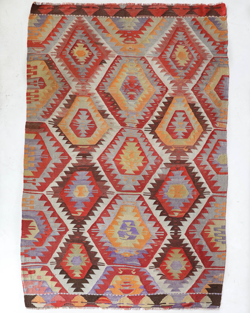 Vintage kilim rug in room decor setting, old rug, antique rug, pastel colors, faded colors, Turkish rug, vintage rug, soft rug, Portland, Oregon, rug store, rug shop, local shop,  antique kilim rug, bold colors, bright colors, faded colors