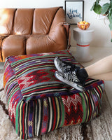 Floor pouf in a living room setting, pillow, turkish pillow, kilim pillow, home decor, decorative pillow, sham, rug pillow, decor, home decor, pouf, floor cushion, cushion, Portland, rugshop, Oregon, Wild Shaman, ottoman