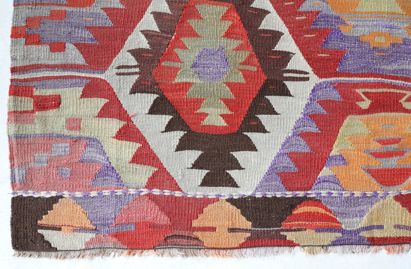 Vintage kilim rug in room decor setting, old rug, antique rug, pastel colors, faded colors, Turkish rug, vintage rug, soft rug, Portland, Oregon, rug store, rug shop, local shop,  antique kilim rug, bold colors, bright colors, faded colors