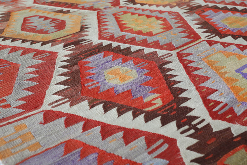 Vintage kilim rug in room decor setting, old rug, antique rug, pastel colors, faded colors, Turkish rug, vintage rug, soft rug, Portland, Oregon, rug store, rug shop, local shop,  antique kilim rug, bold colors, bright colors, faded colors