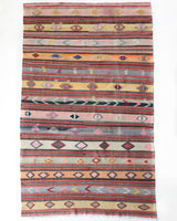 Vintage kilim rug in room decor setting, old rug, antique rug, pastel colors, faded colors, Turkish rug, vintage rug, soft rug, Portland, Oregon, rug store, rug shop, local shop,  antique kilim rug, bold colors, bright colors, faded colors