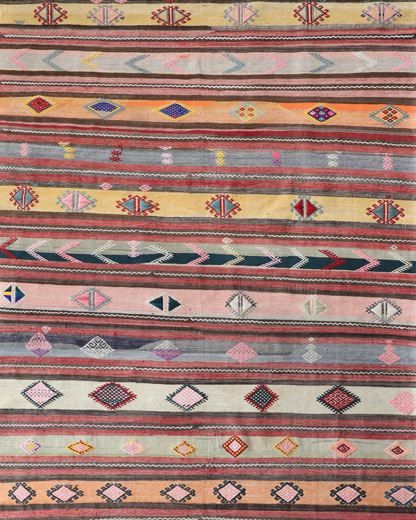 Vintage kilim rug in room decor setting, old rug, antique rug, pastel colors, faded colors, Turkish rug, vintage rug, soft rug, Portland, Oregon, rug store, rug shop, local shop,  antique kilim rug, bold colors, bright colors, faded colors