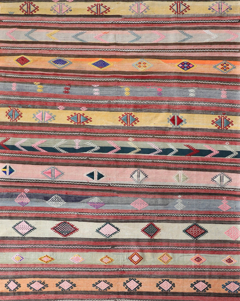 Vintage kilim rug in room decor setting, old rug, antique rug, pastel colors, faded colors, Turkish rug, vintage rug, soft rug, Portland, Oregon, rug store, rug shop, local shop,  antique kilim rug, bold colors, bright colors, faded colors