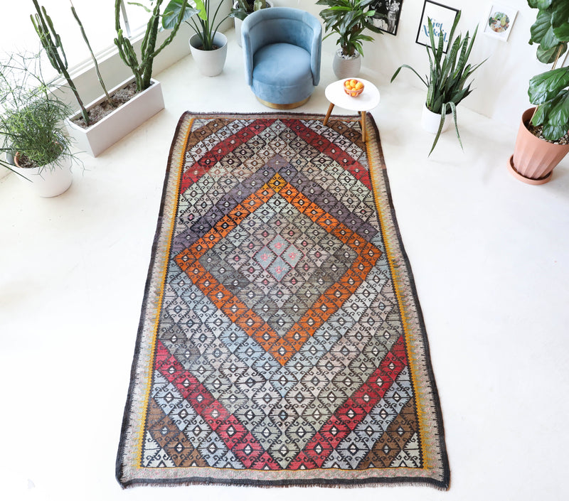 Vintage kilim rug in living room setting, bright colors, wild shaman, soft rug, bold color, Portland, Oregon, rug store, rug shop, local shop, vintage rug, modern kilim, warm colors