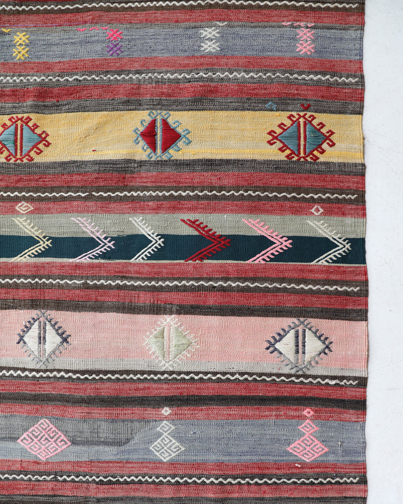 Vintage kilim rug in room decor setting, old rug, antique rug, pastel colors, faded colors, Turkish rug, vintage rug, soft rug, Portland, Oregon, rug store, rug shop, local shop,  antique kilim rug, bold colors, bright colors, faded colors