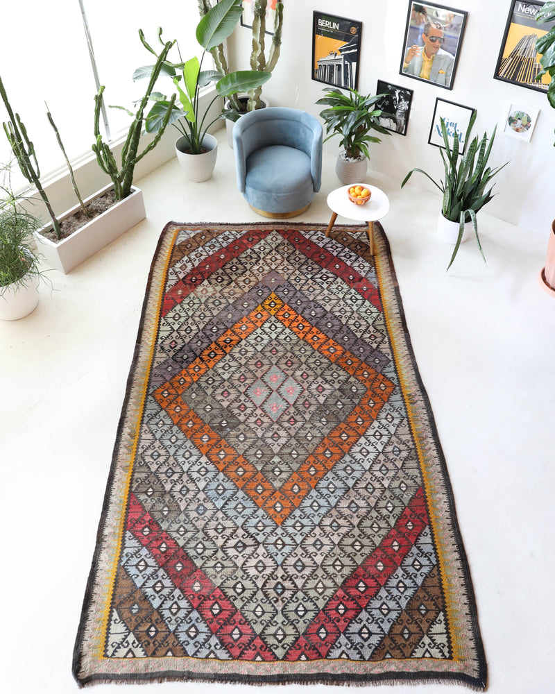 Vintage kilim rug in living room setting, bright colors, wild shaman, soft rug, bold color, Portland, Oregon, rug store, rug shop, local shop, vintage rug, modern kilim, warm colors