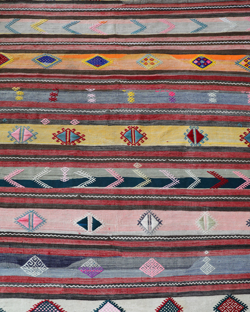 Vintage kilim rug in room decor setting, old rug, antique rug, pastel colors, faded colors, Turkish rug, vintage rug, soft rug, Portland, Oregon, rug store, rug shop, local shop,  antique kilim rug, bold colors, bright colors, faded colors