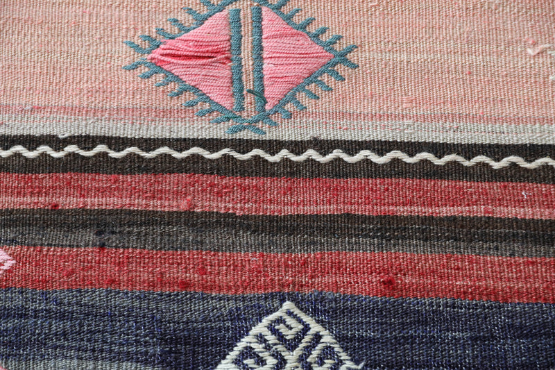 Vintage kilim rug in room decor setting, old rug, antique rug, pastel colors, faded colors, Turkish rug, vintage rug, soft rug, Portland, Oregon, rug store, rug shop, local shop,  antique kilim rug, bold colors, bright colors, faded colors