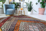 Vintage kilim rug in living room setting, bright colors, wild shaman, soft rug, bold color, Portland, Oregon, rug store, rug shop, local shop, vintage rug, modern kilim, warm colors