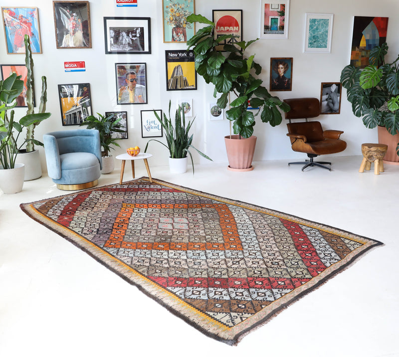 Vintage kilim rug in living room setting, bright colors, wild shaman, soft rug, bold color, Portland, Oregon, rug store, rug shop, local shop, vintage rug, modern kilim, warm colors