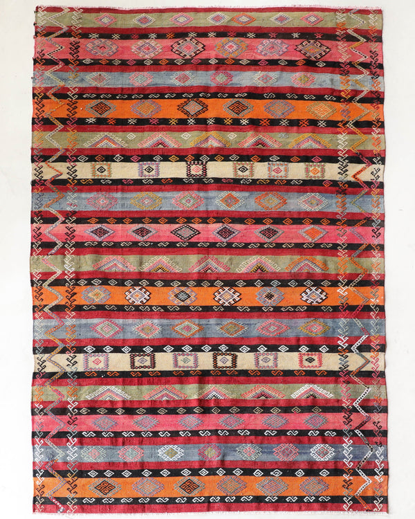 Vintage kilim rug in living room setting, bright colors, wild shaman, soft rug, bold color, Portland, Oregon, rug store, rug shop, local shop, vintage rug, modern kilim, warm colors