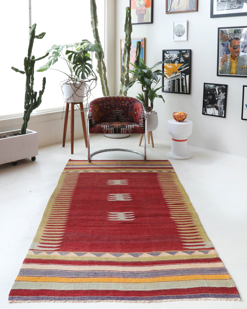 Vintage kilim rug in living room setting, old rug, antique rug, pastel colors, faded colors, Turkish rug, vintage rug, soft rug, Portland, Oregon, rug store, rug shop, local shop, earthy tones, earthy colors, warm colors